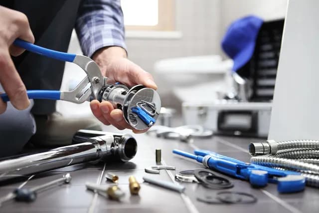 SM Plumbing Service technician completing a repair in Singapore